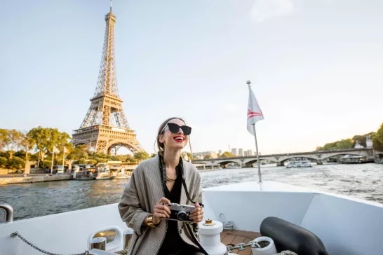 Woman enjoying landscape view on Paris city from the boat