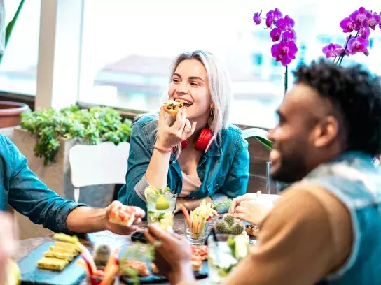 Group of friends eating at a restaurant