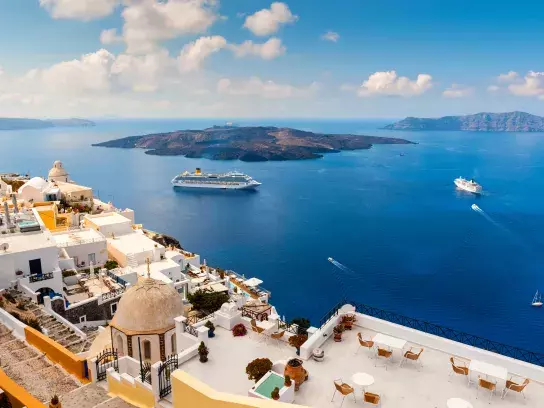 A shot of two cruise ships at the port at Santorini, Greece