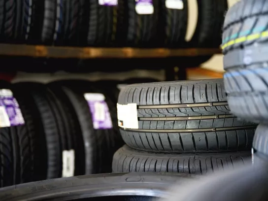 New tires with labels in shop