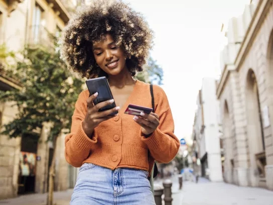 Women in Barcelona shopping online on the move