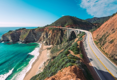 Cars drive on the Pacific Coast Highway at Big Sur in California, USA