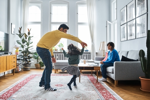 Family dancing in apartment