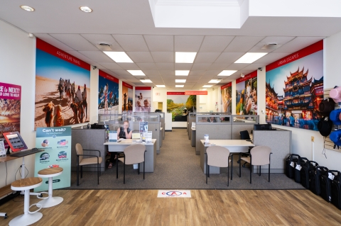 Inside CAA North Bay with desks and luggage