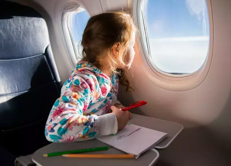 Family with child on an airplane ready to take flight