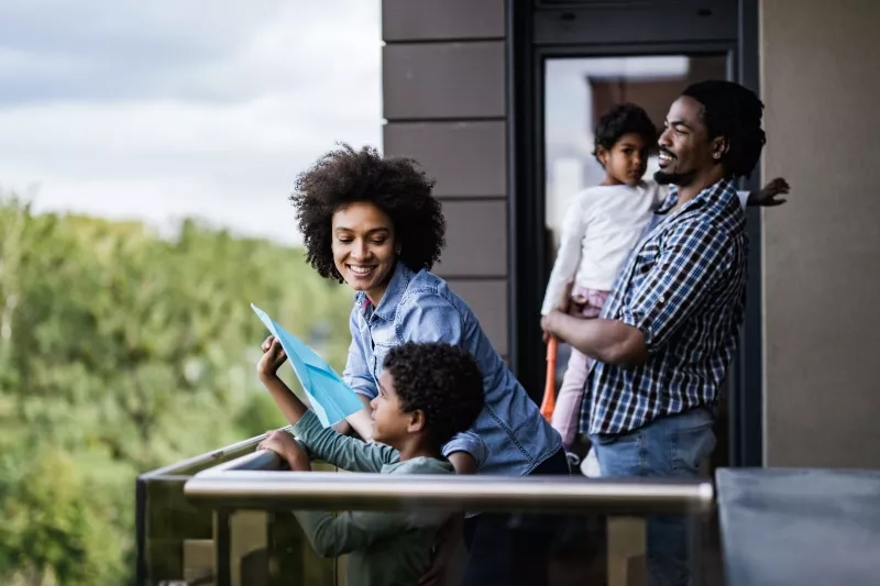 young family on balcony