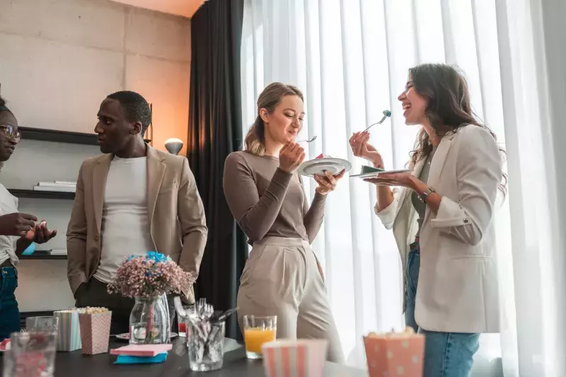 young friends eating cake at part