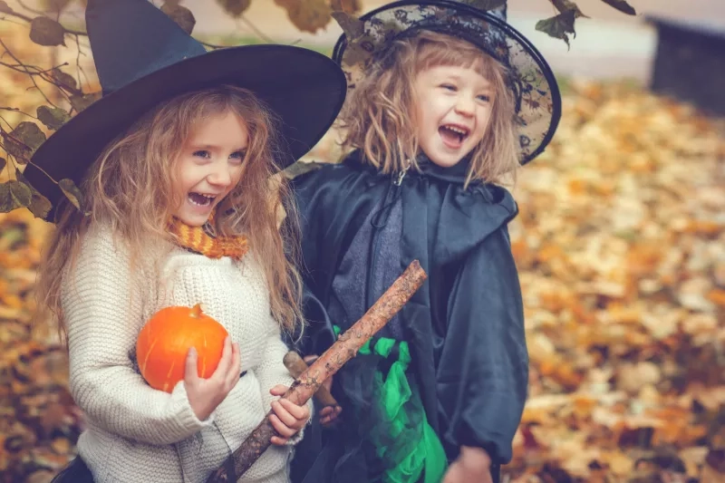 Little girls dressed as witch at Halloween