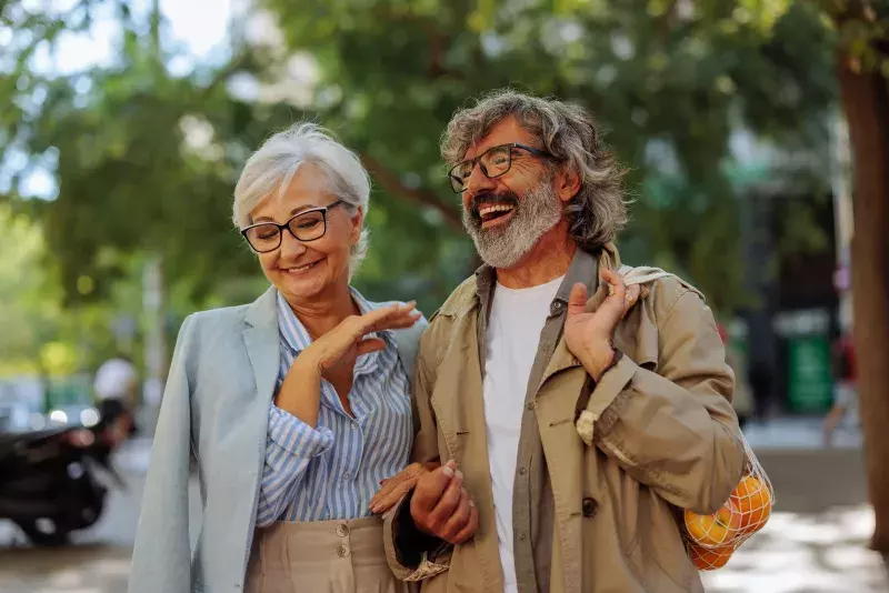 Cheerful senior couple outside