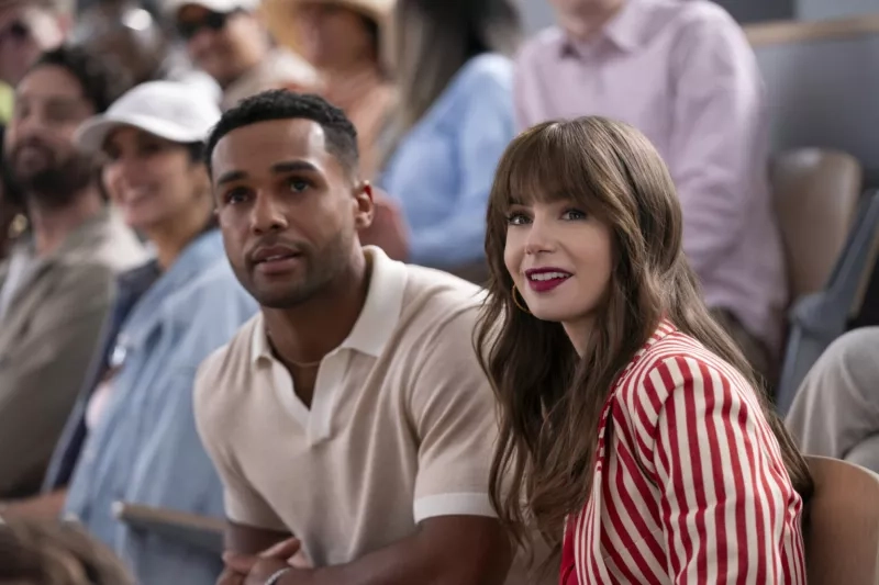 A couple seated at a sporting event in the stands