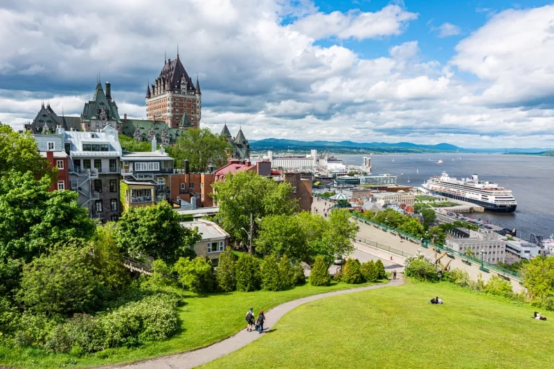 The frontenac castle and the St. Lawrence river with a cruise ship at the harbor in the Quebec city