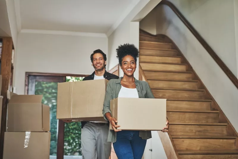 Happy couple moving into new home