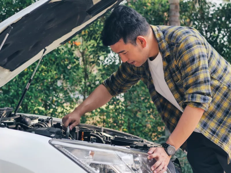 man open car hood and check up his car