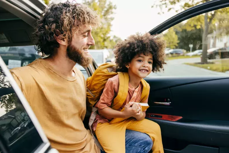 father with son in a car