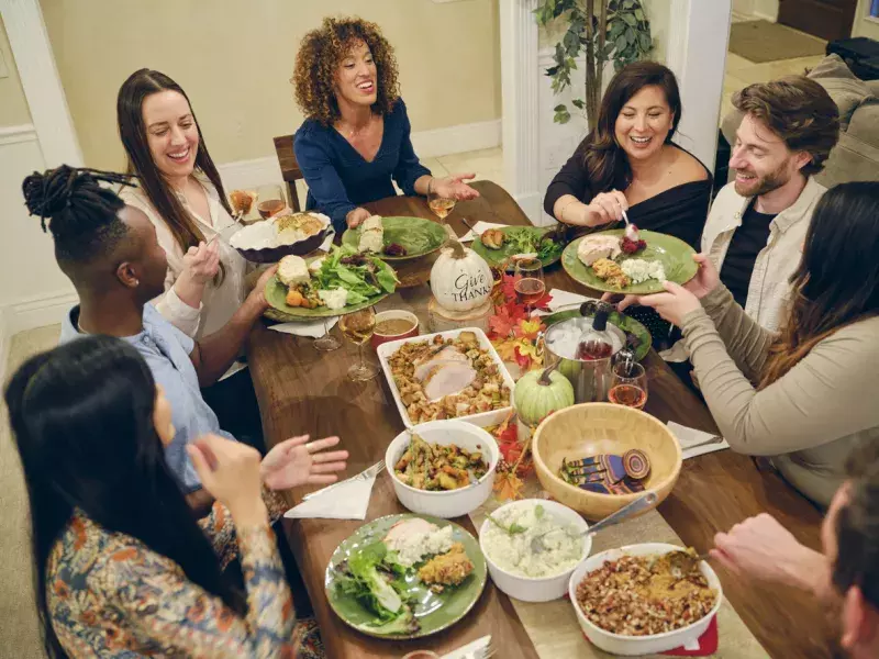 A group of friends celebrating Thanksgiving together