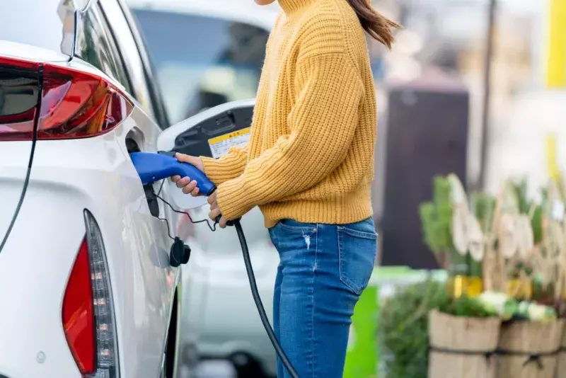 woman pumping gas