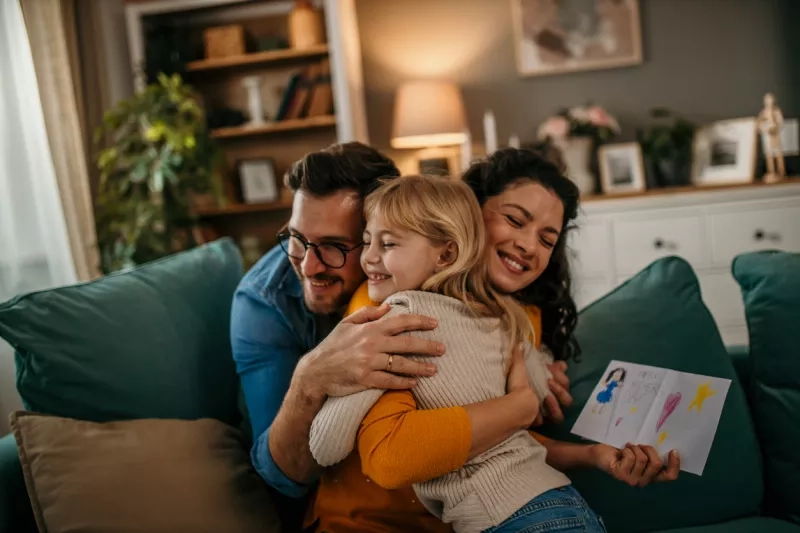 ad and daughter sharing a touching moment as they surprise mom