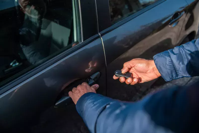 Close-up of male hand using car fob