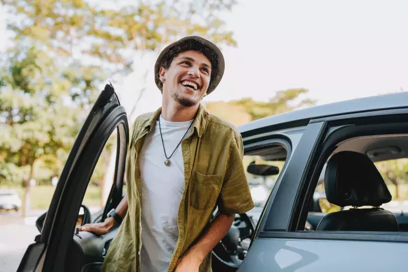 man leaving his car