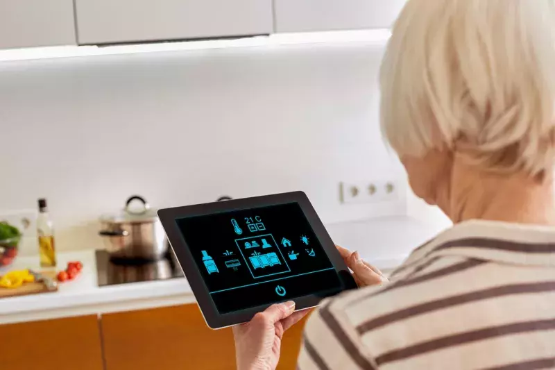 woman controlling smart home on digital tablet