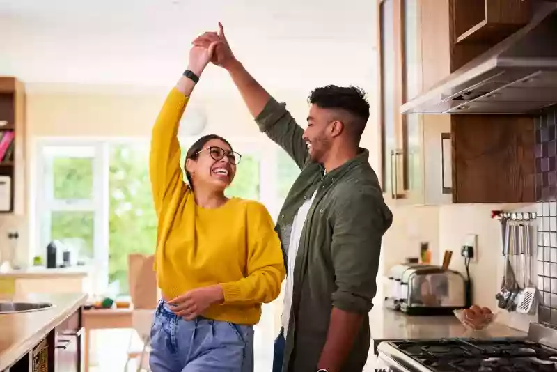 Couple dancing in kitchen