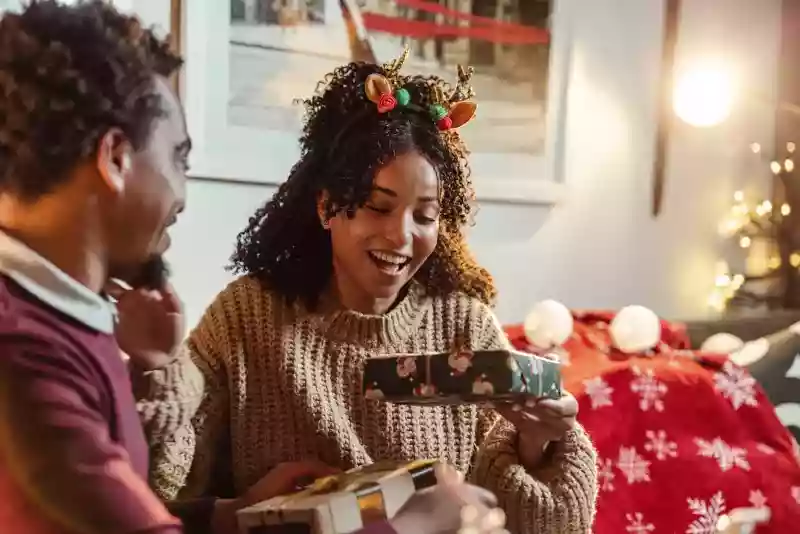 Woman getting a Christmas present