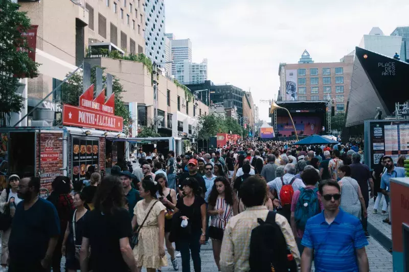 A crowd view from Montréal Jazz Festival 2023. In front of Place des Arts on St-Catherine street. The Montreal Jazz Festival is the world's largest jazz festival held in Montreal, Quebec.