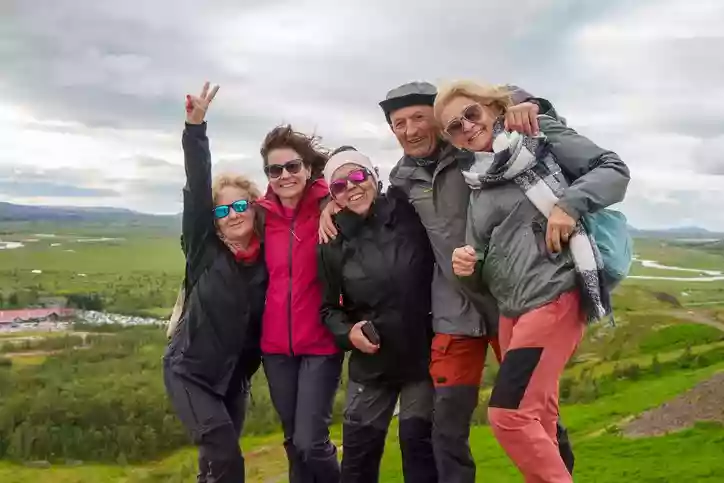 Group posing on a hilltop in Iceland