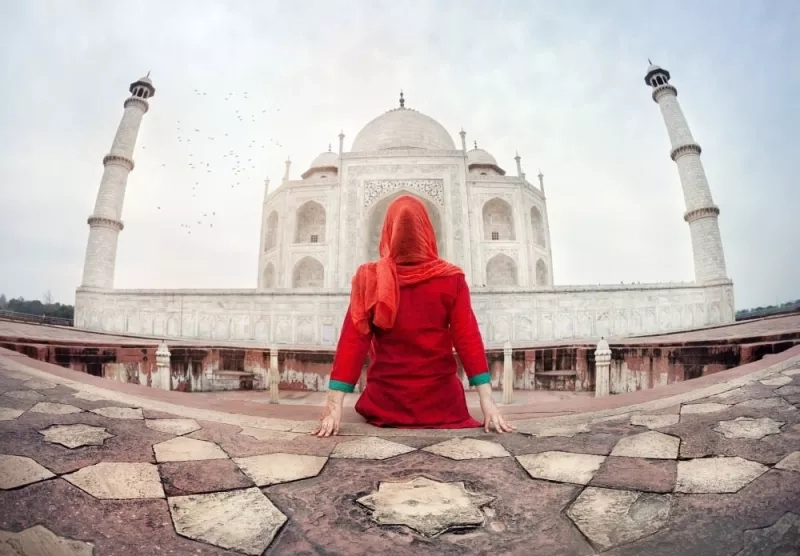 woman sitting outside the Taj Mahal