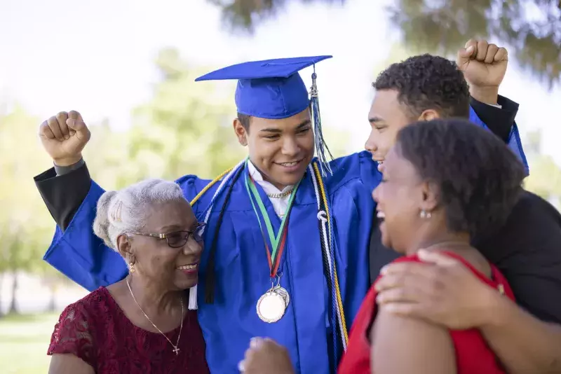 Family celebrating a sons graduation.