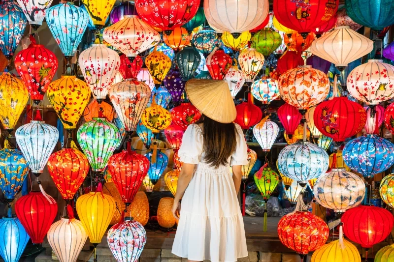 woman is enjoy watching lanterns in old town Hoi An