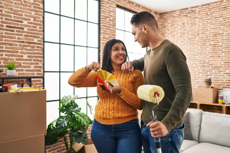 Couple picking paint colours