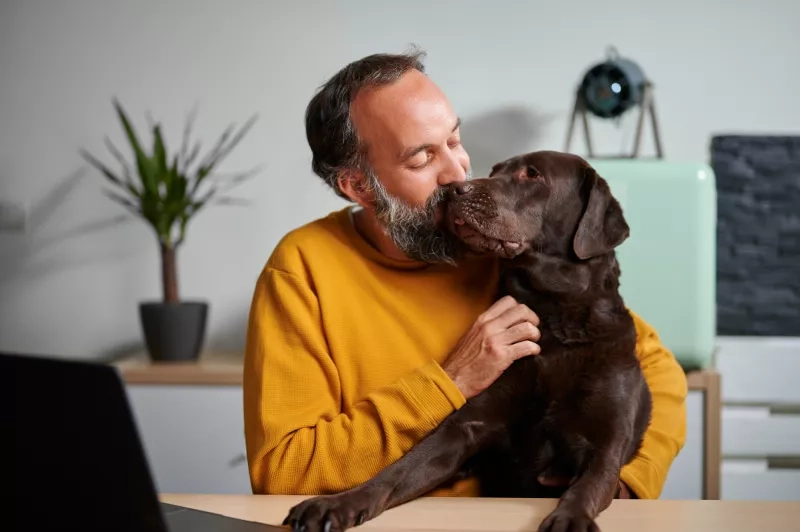 Man hugging dog