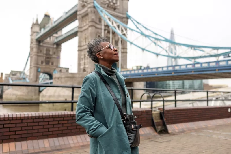 Tourist Looking Around And Admiring The Majestic Landmarks In London