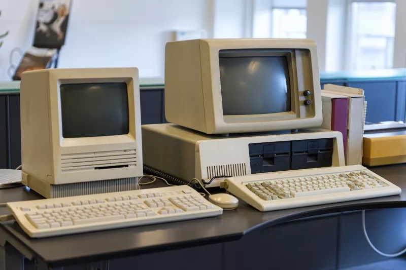 old computers on an office desk 