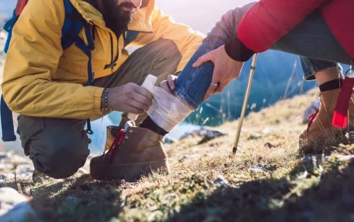 A woman has sprained her ankle while hiking