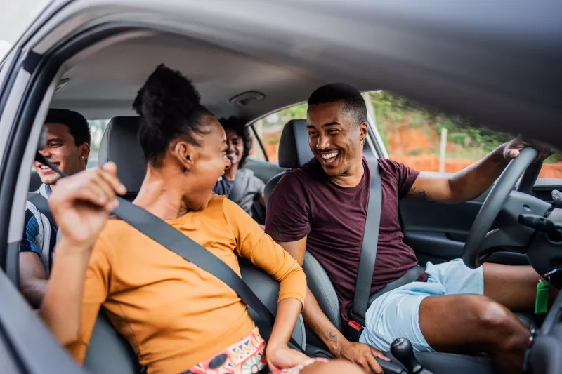 Friends talking in a car