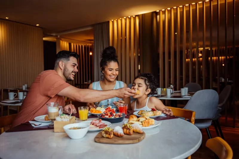 Family eating breakfast together on vacation