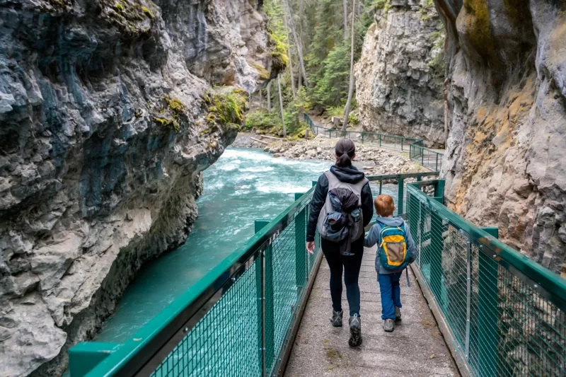 Mother and Son Hiking at Johnson Canyon in Banff National Park