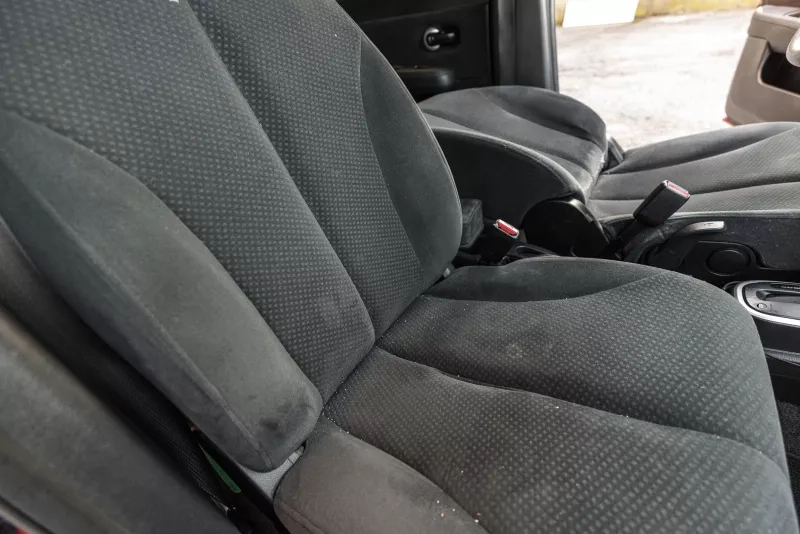 Passenger seat with crumbs and stains 