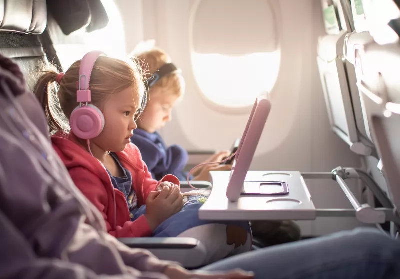 Adorable little boy girl travel by plane