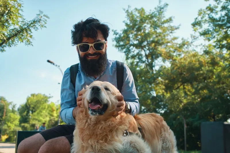 Man and dog outside in park
