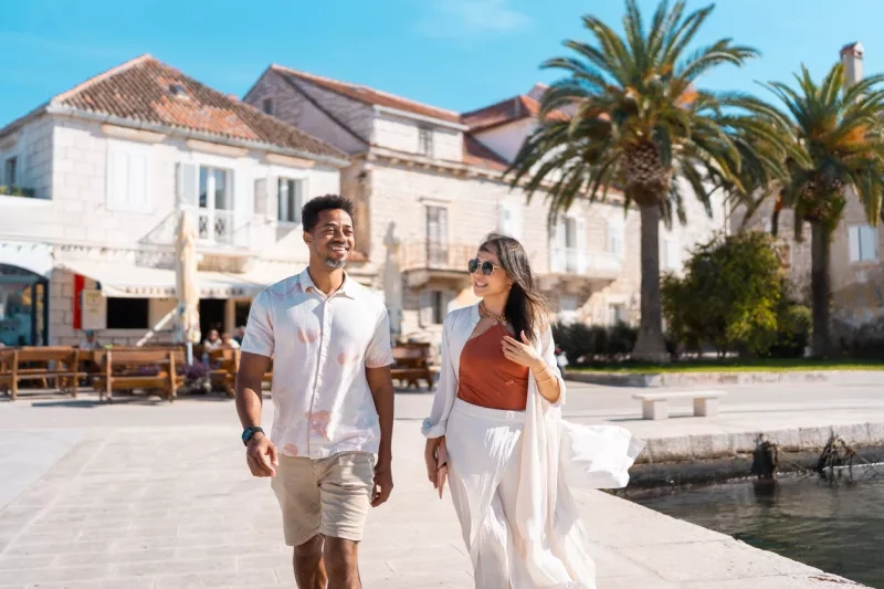 Couple strolling in coastal town 