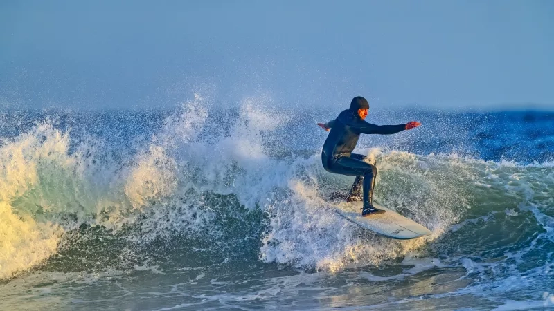 surfer catching a wave
