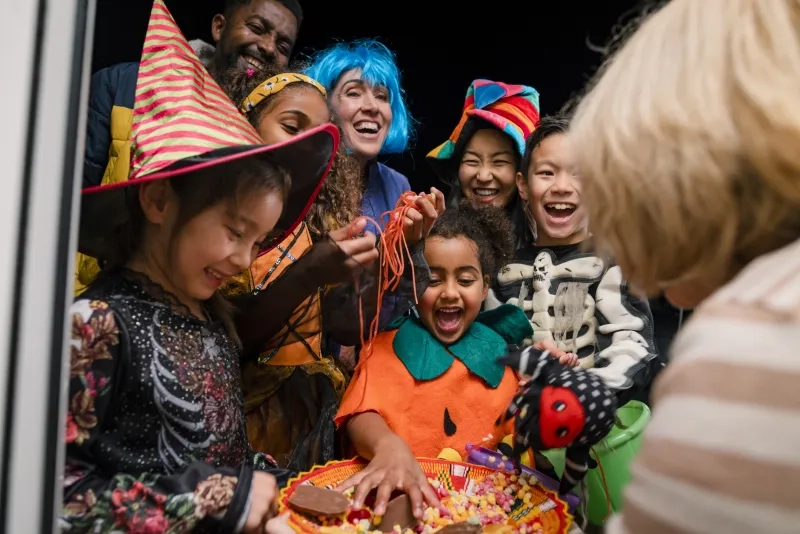 Kids taking Halloween candy