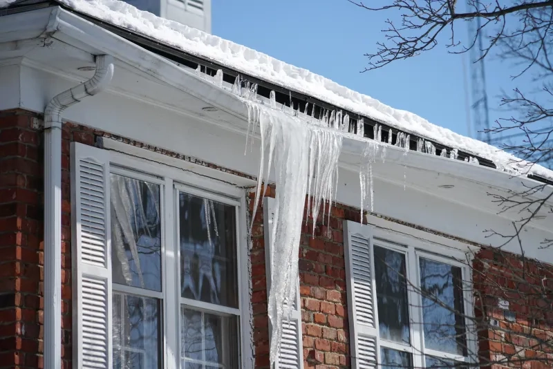 icicle on the house roof in winter