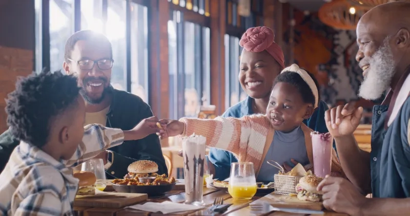 parents with children in restaurant for lunch