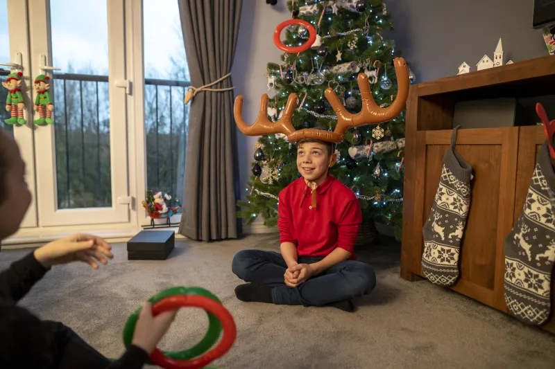 family playing game at christmas