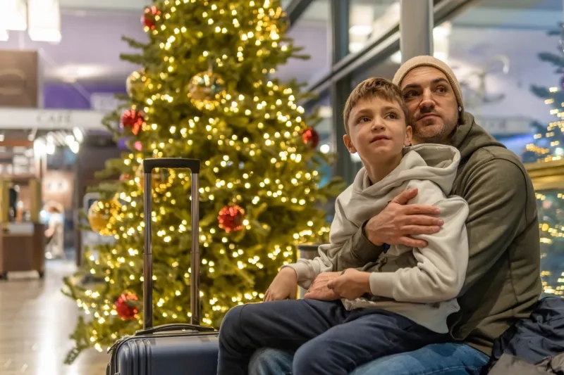 Father with his son waiting for airplane