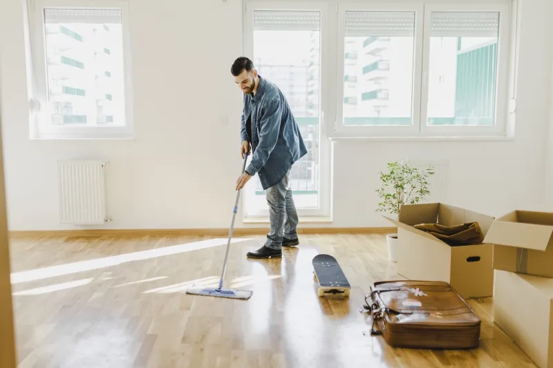 man cleaning floors in home